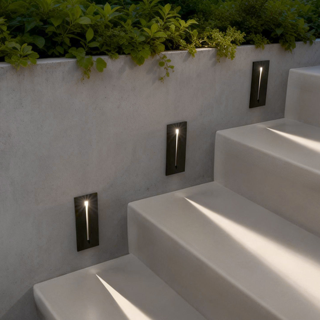 Slit stair lamp enhancing a contemporary outdoor staircase with elegant ambient light.