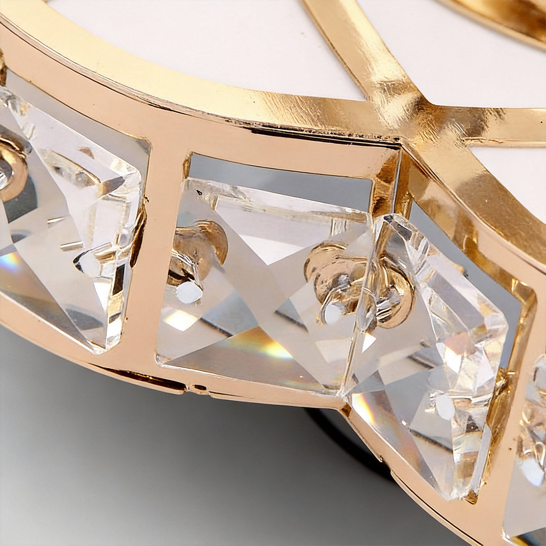 Close-up detail showing crystal elements of a small flush mount ceiling light.