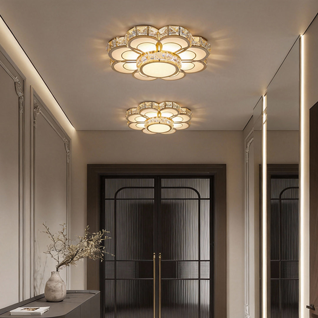 Small crystal flush mount ceiling light used in a minimalist entryway ceiling.