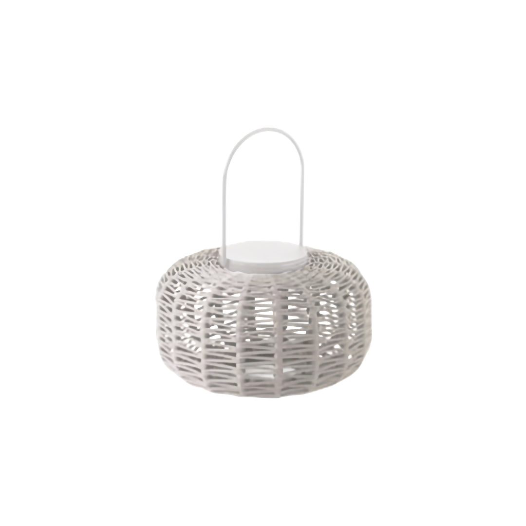 Small, dome-shaped outdoor LED lantern in a light gray/white woven resin with a white handle, suitable for tabletop use.