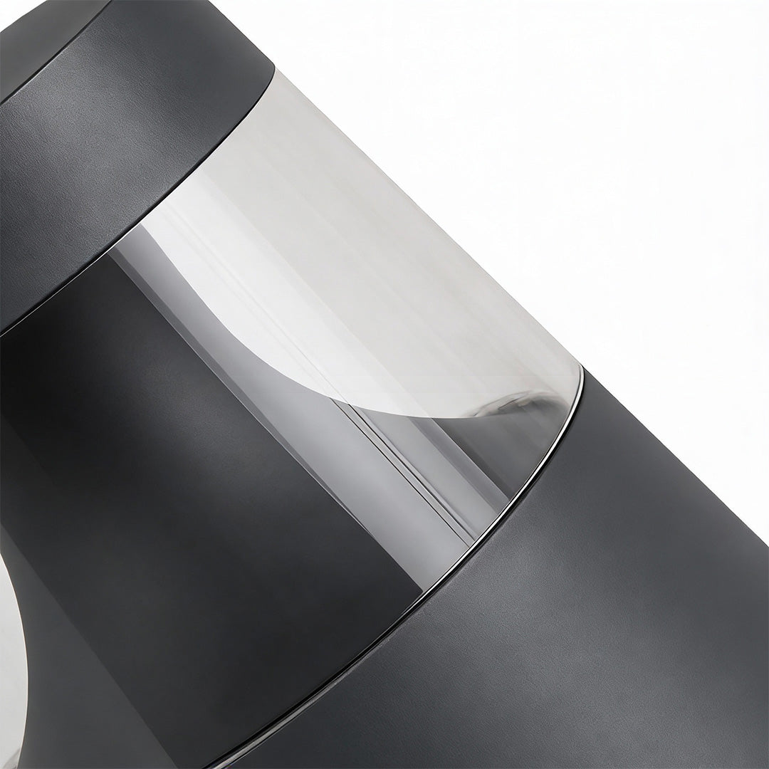 Close up of small landscape lights diffuser and housing, showing material texture and light output detail.