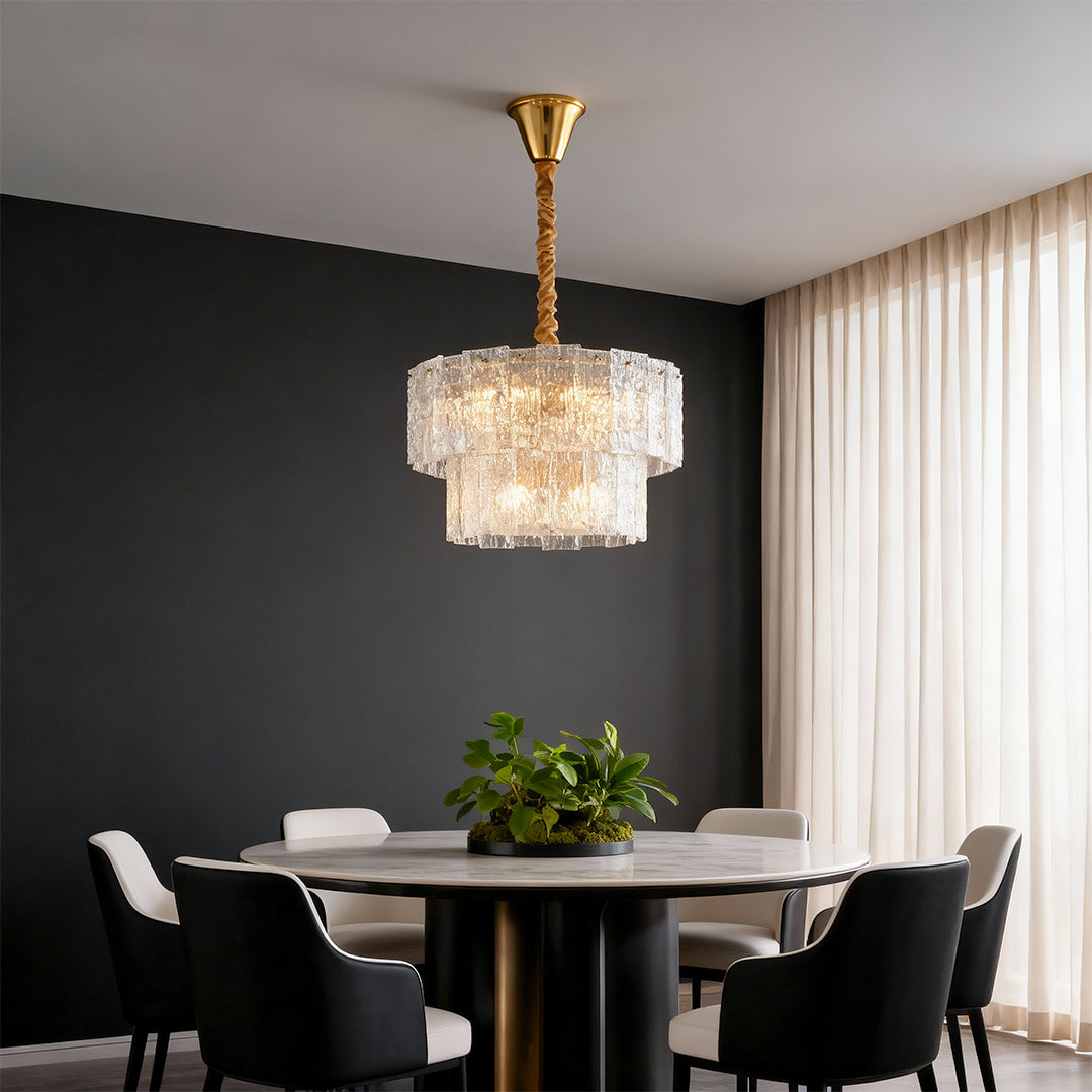 Modern luxury chandeliers lighting contemporary dining space with dark accent wall and grey chairs