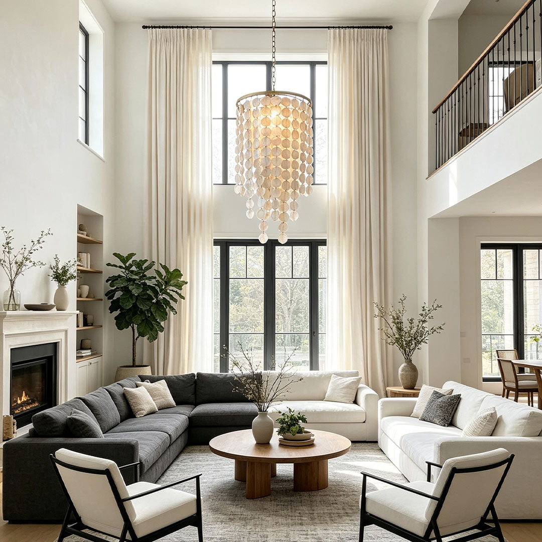 Small staircase chandelier creating an elegant focal point in a modern living space.