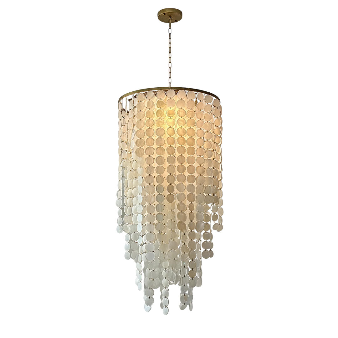 Small staircase chandelier with warm illumination and cascading translucent glass decorations.