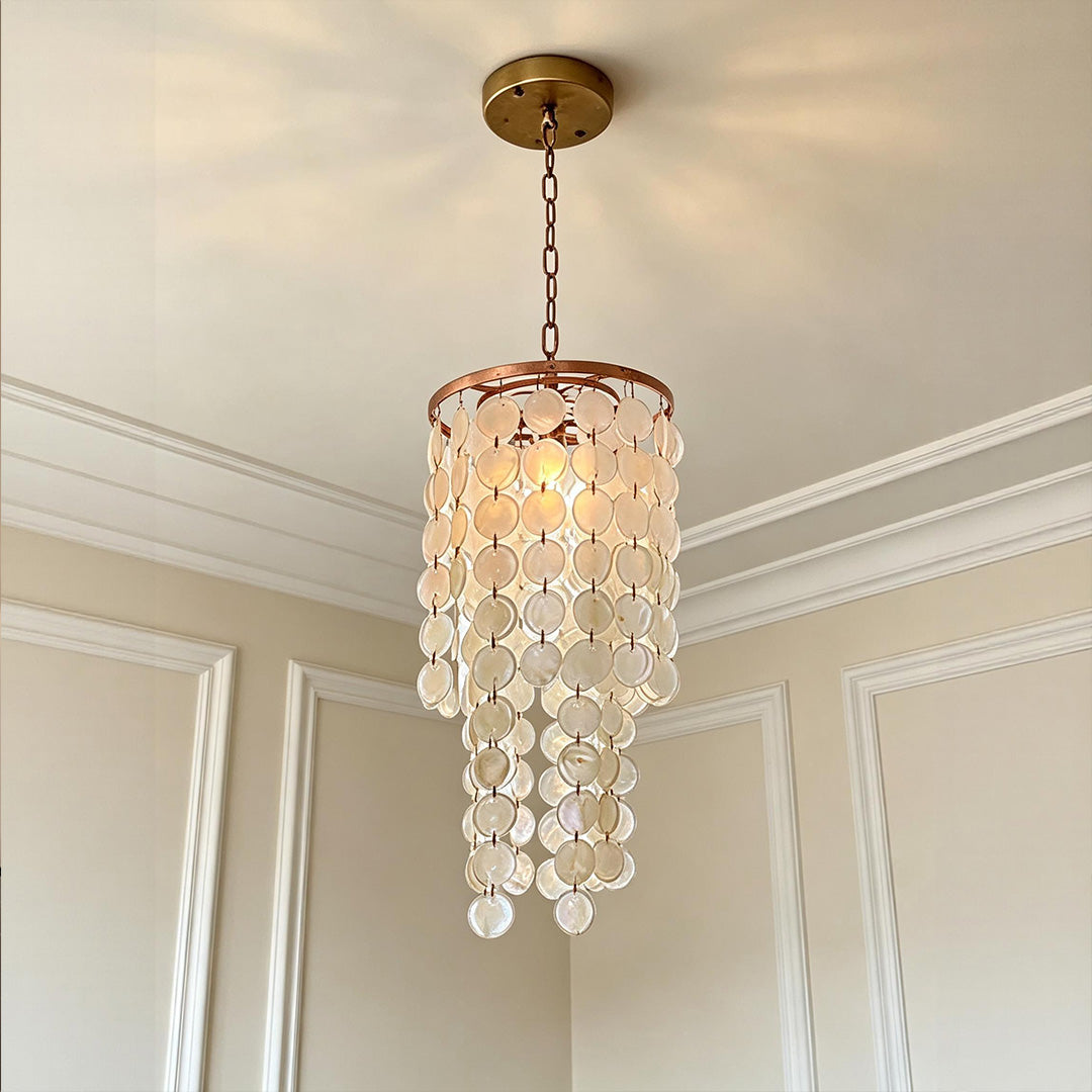 Small staircase chandelier with cascading glass discs and elegant pendant design for modern interiors.