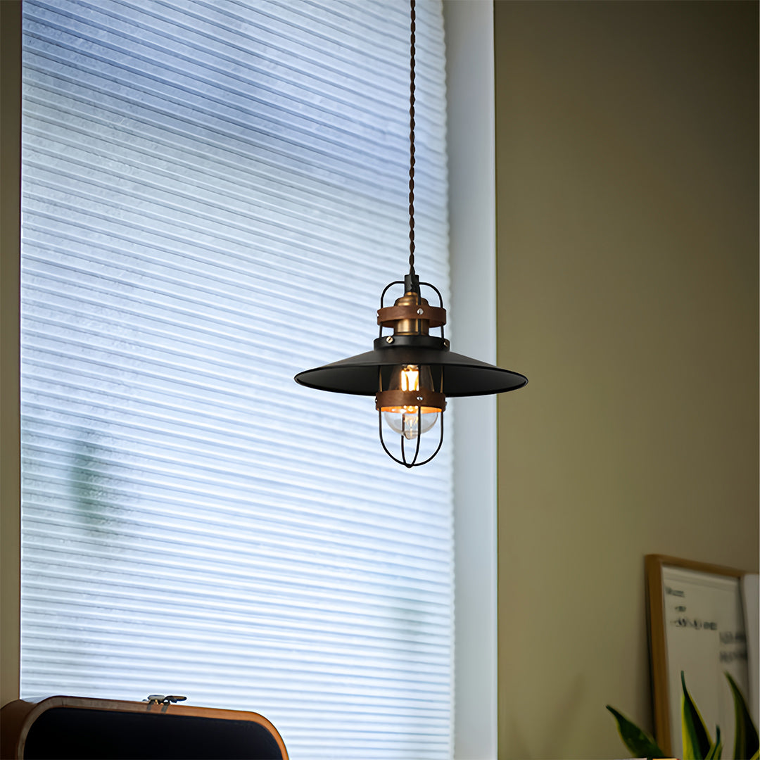 Small vintage hanging pendant lights fixture hanging against bright window blinds 