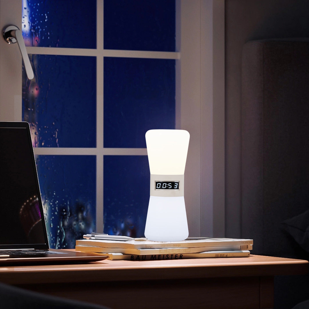 Small white USB rechargeable table lamp on window sill providing gentle evening illumination