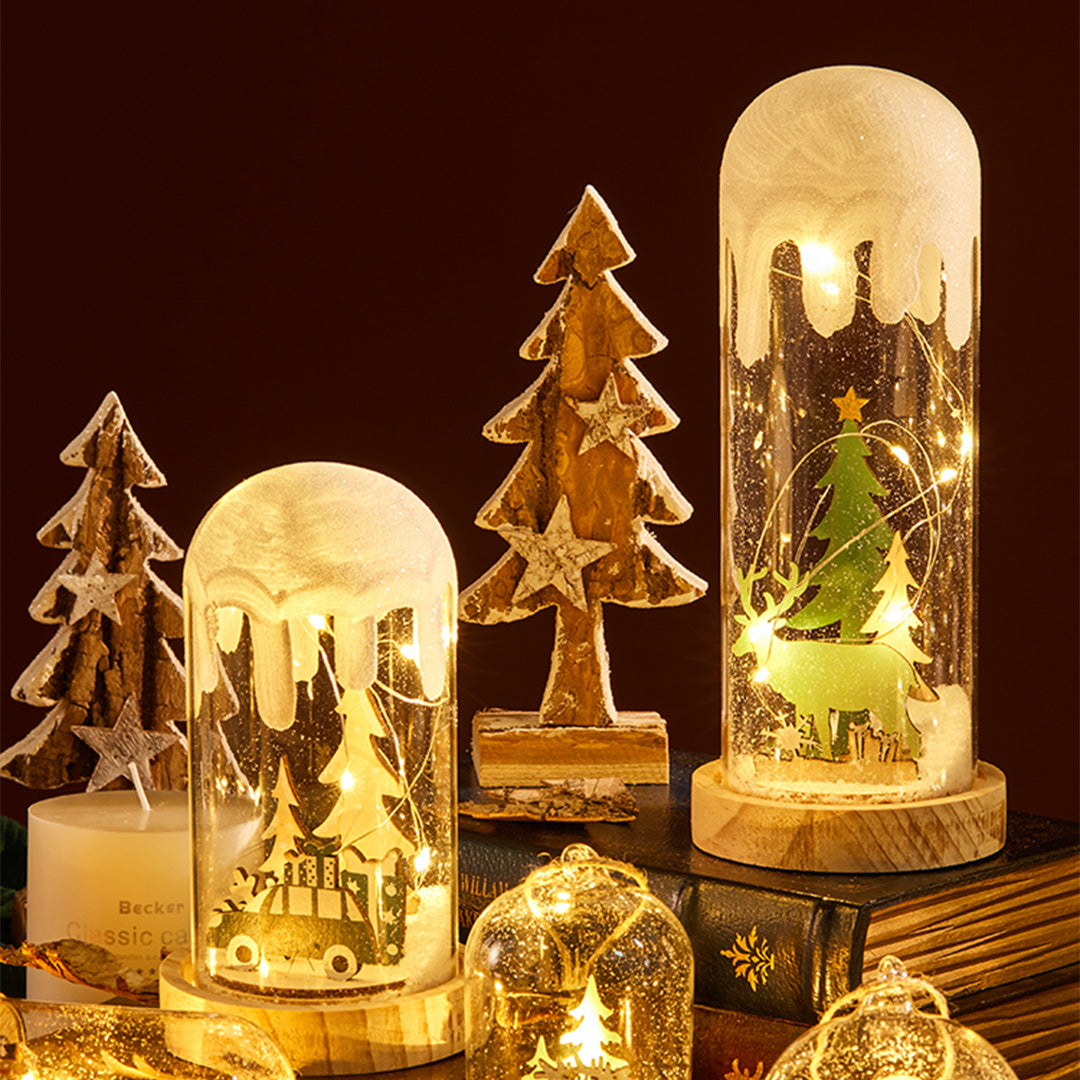 Snow-globe style decor lamp emitting warm light, resembling a winter-themed white glass table lamp.