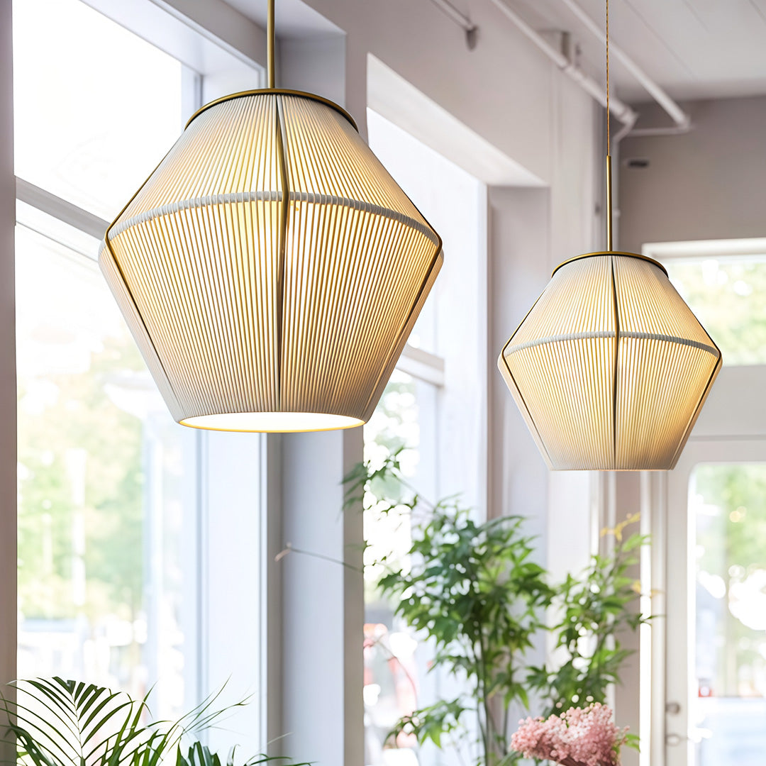 Soft glowing Japanese-style pendant light hanging in a contemporary dining area, creating a serene atmosphere.