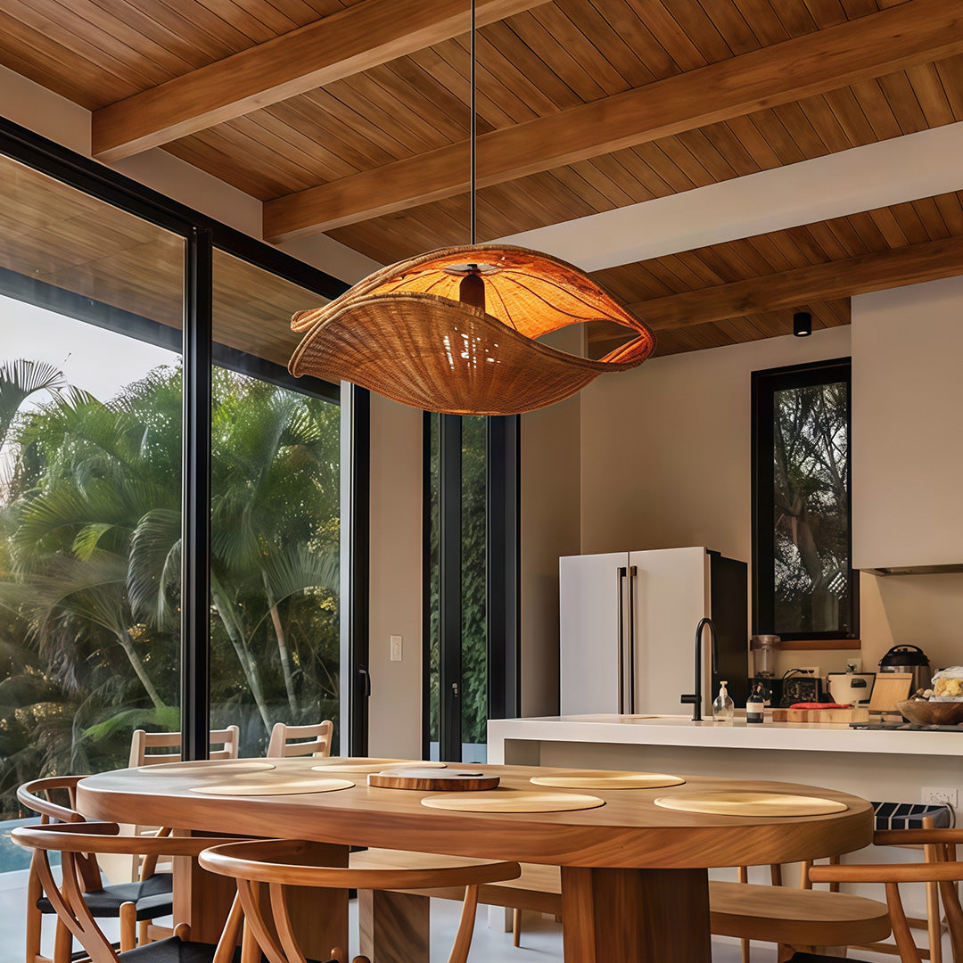 Softly glowing rattan pendant light in a stylish living room, creating a warm and inviting atmosphere.