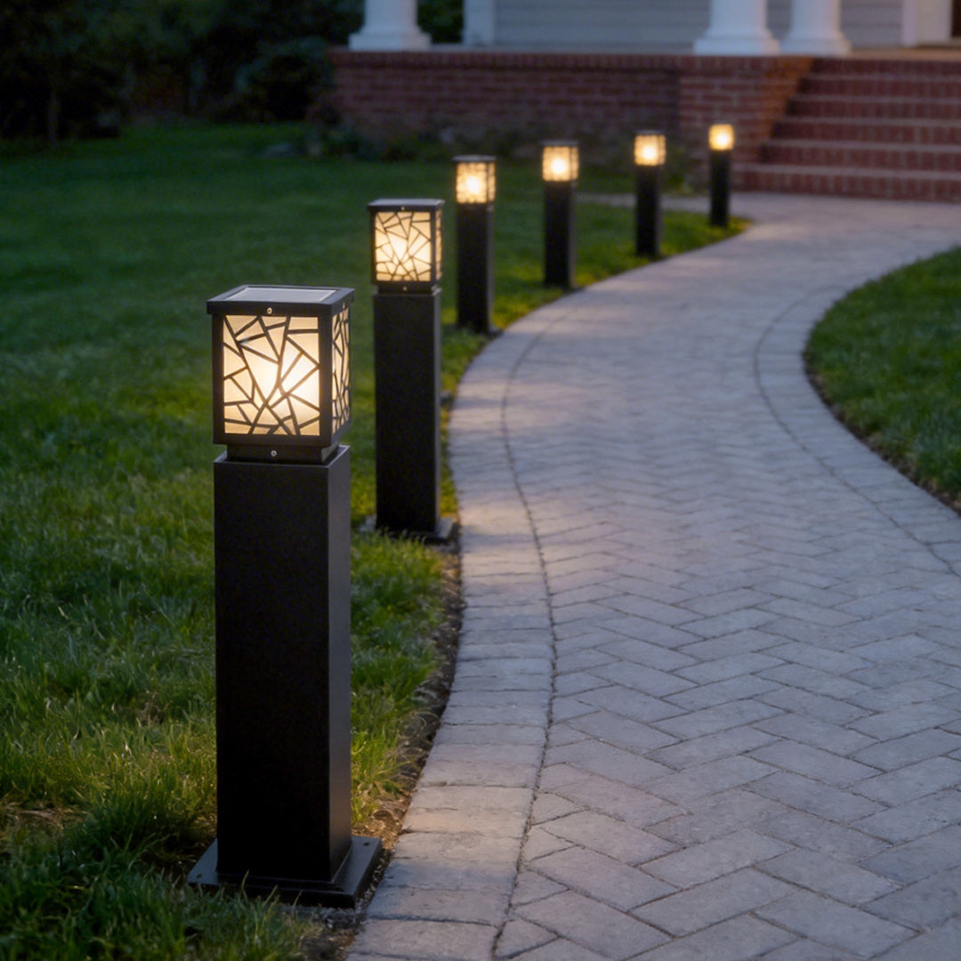 Solar bollard path lights enhancing a contemporary house entrance with elegant directional light.