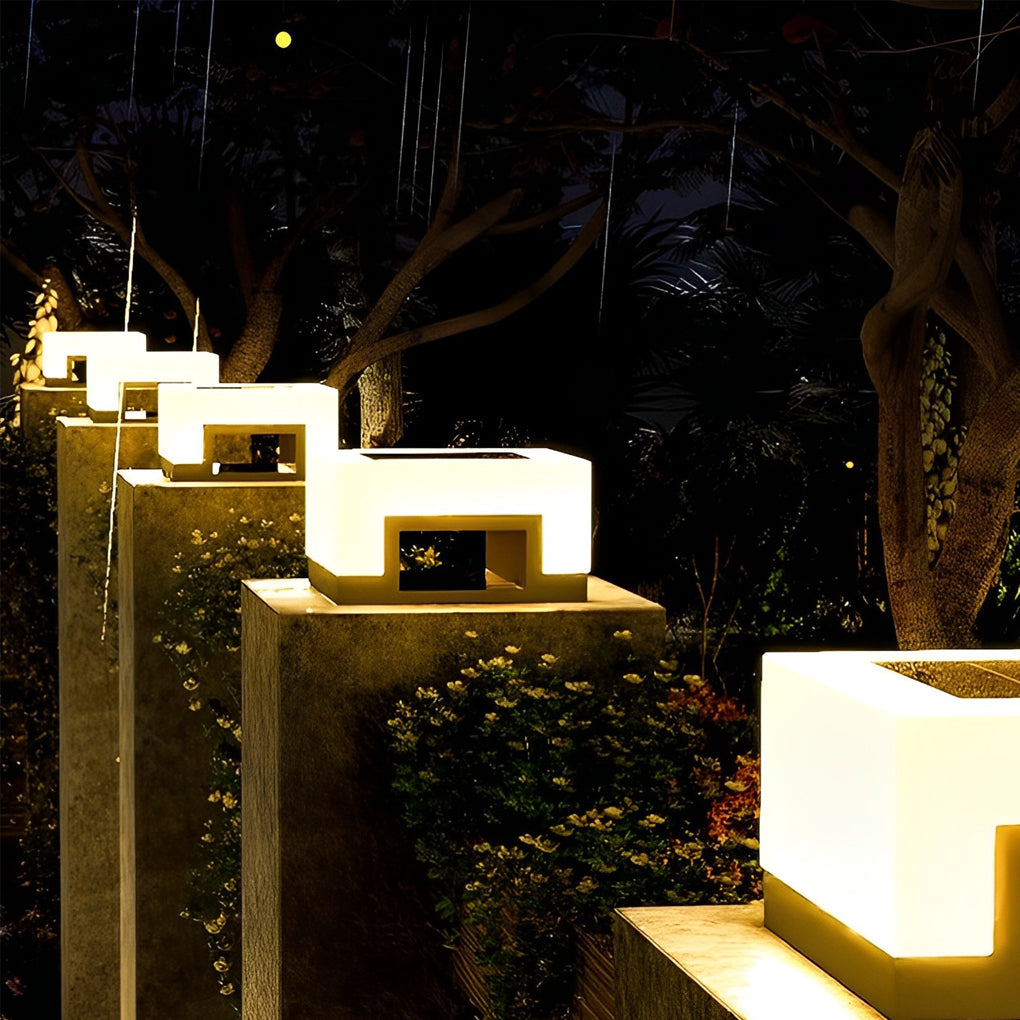 Close-up of illuminated solar front lawn light with frosted diffuser.