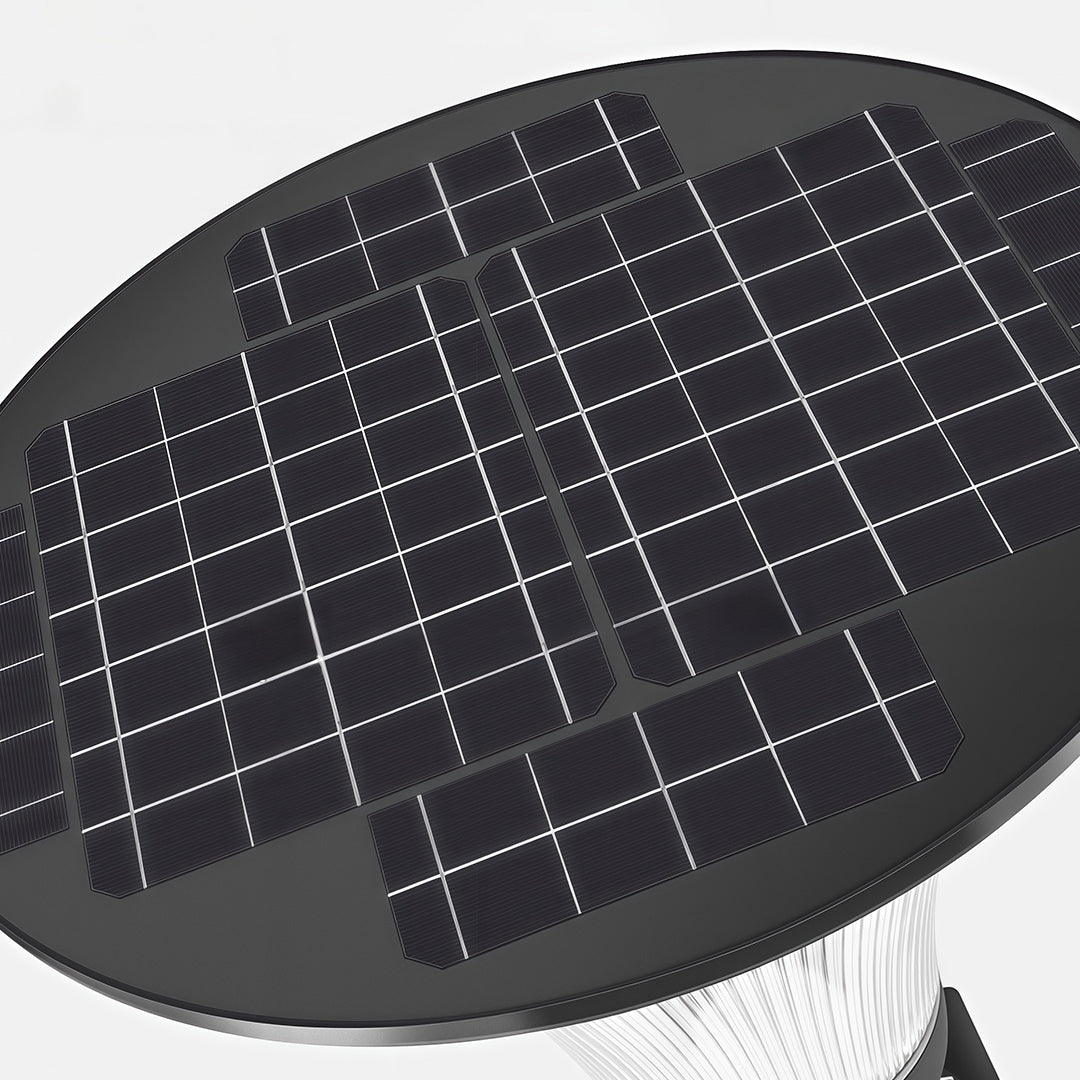 Close-up of a solar garden light with a detailed design, illuminating a garden area.