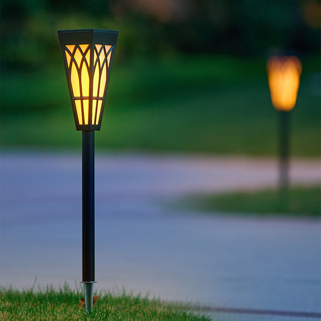 Solar landscape lighting with decorative lantern design creating evening ambiance