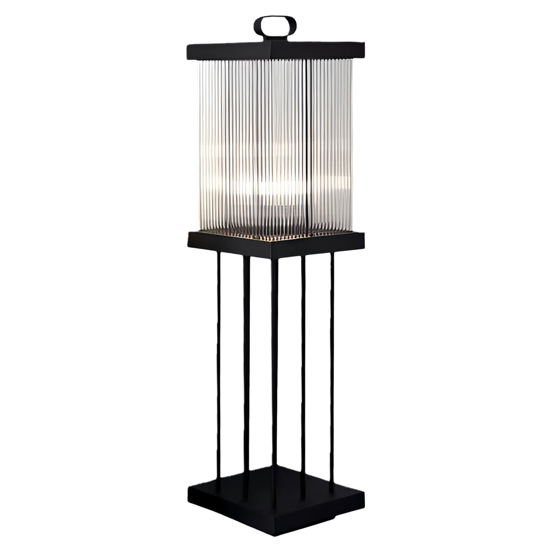 Solar lantern on tall stand providing pathway and landscape illumination.