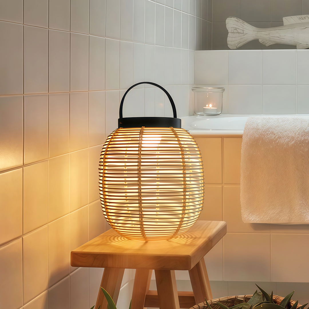 Solar lantern with LED lights illuminating a garden table, combining natural materials with sustainable energy.