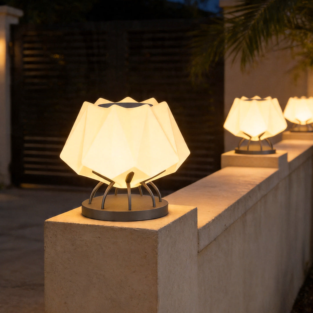 Solar led pillar lights arranged along modern exterior wall creating stylish ambient illumination.