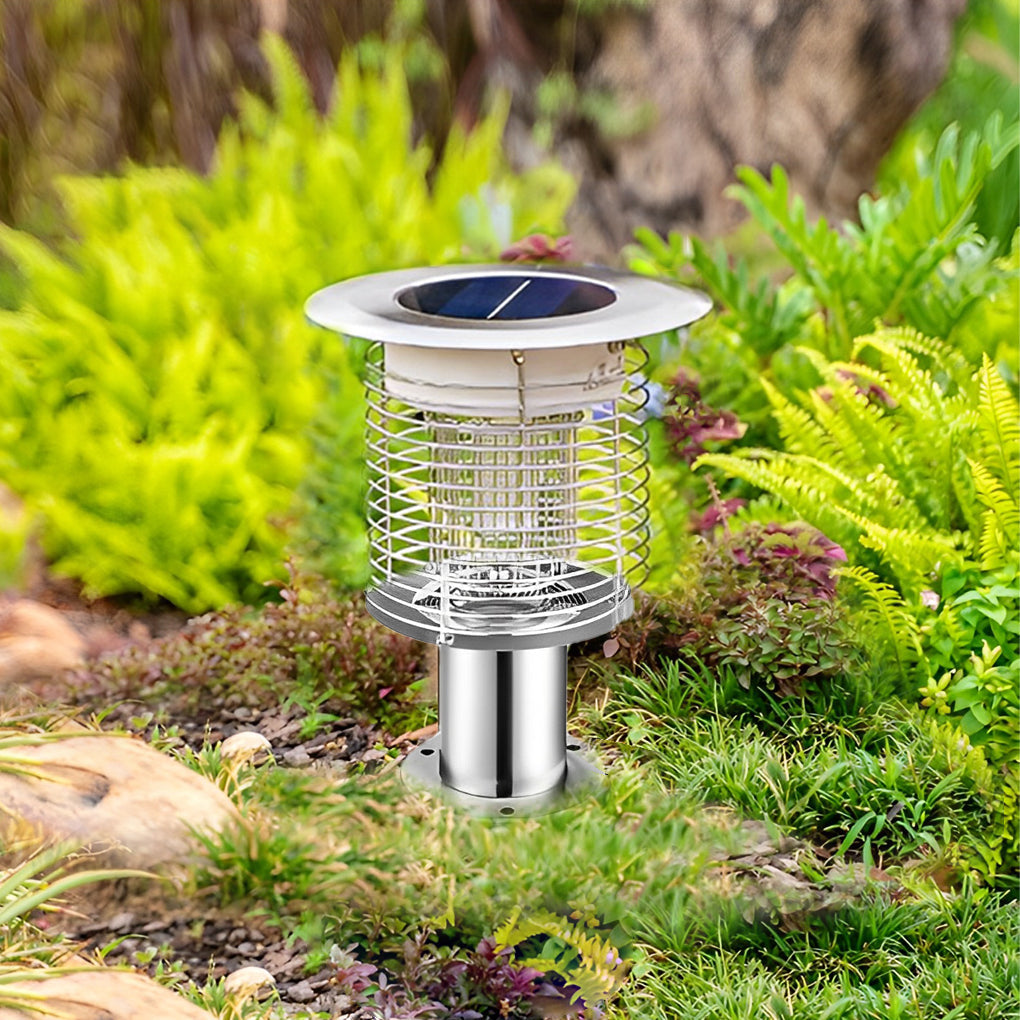 Solar light bug zapper placed in garden during daytime.