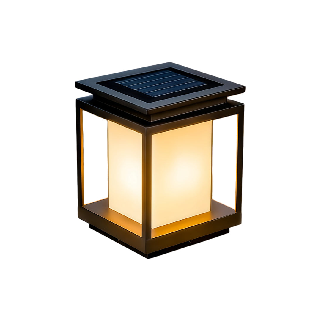 Modern solar light for main gate pillar installed on concrete entrance columns at luxury home driveway.