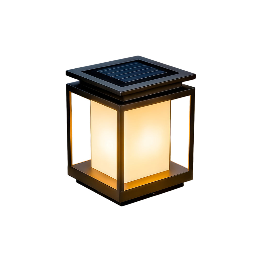 Modern solar light for main gate pillar installed on concrete entrance columns at luxury home driveway.