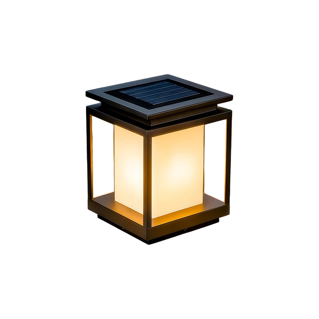 Modern solar light for main gate pillar installed on concrete entrance columns at luxury home driveway.