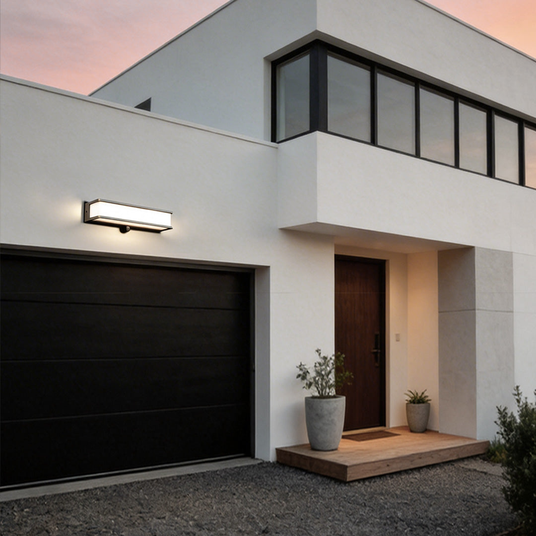 Solar light outdoor wall mount with a sleek design, enhancing a modern house facade.