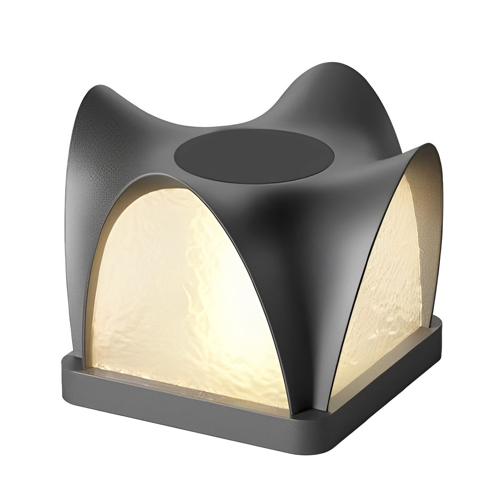 Solar light pillar with a modern design, enhancing an outdoor seating area.