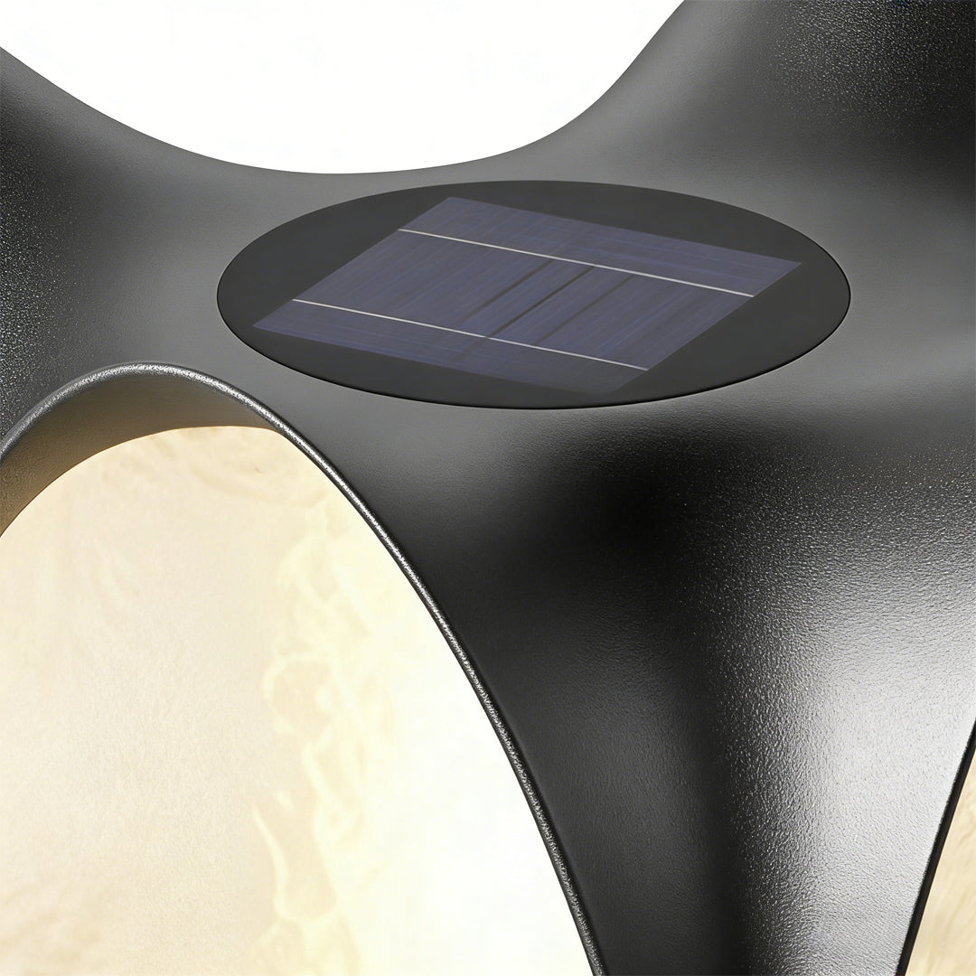 Solar light pillar with a sleek design, providing soft illumination near a lawn.