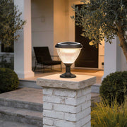 Solar light post cap illuminating a modern garden pathway with warm directional glow.