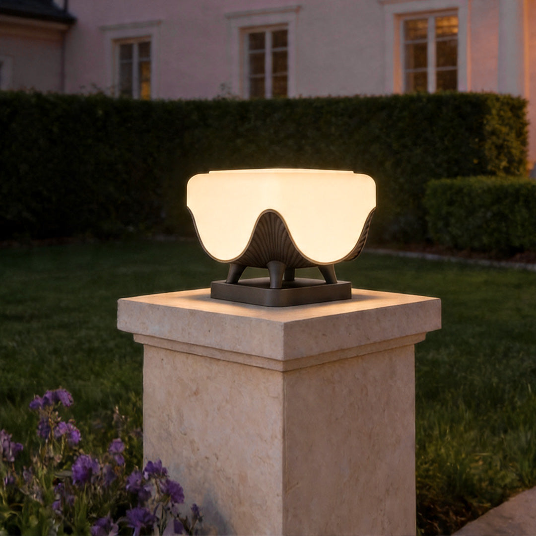 Solar lights for pillar tops on concrete garden pillar with stylish decorative outdoor lighting design.