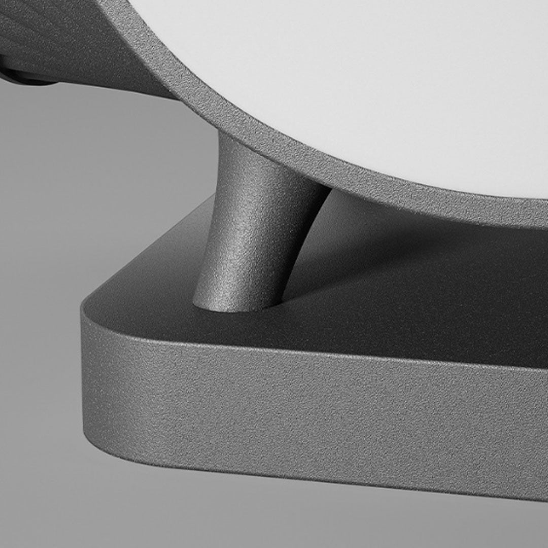 Close-up detail of solar lights for pillar tops showing curved metal support and textured base.