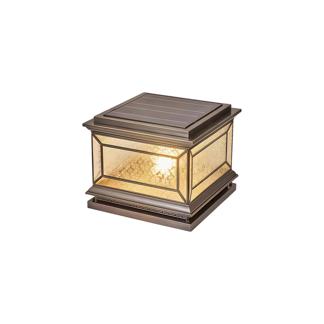 Decorative solar lights pillar isolated on white background with luxurious bronze accents.