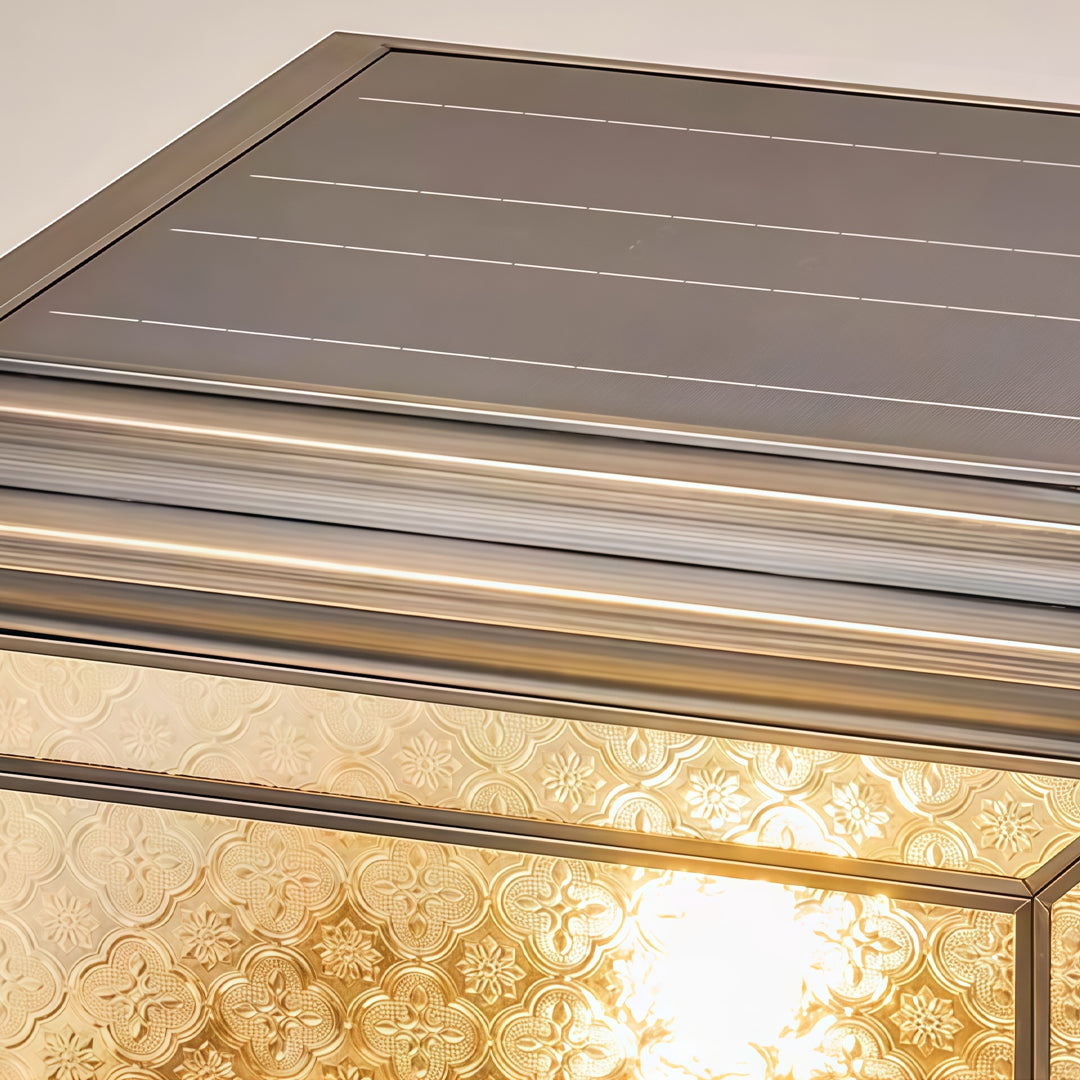 Detailed top view of solar lights pillar with integrated solar charging panel and bronze trim.