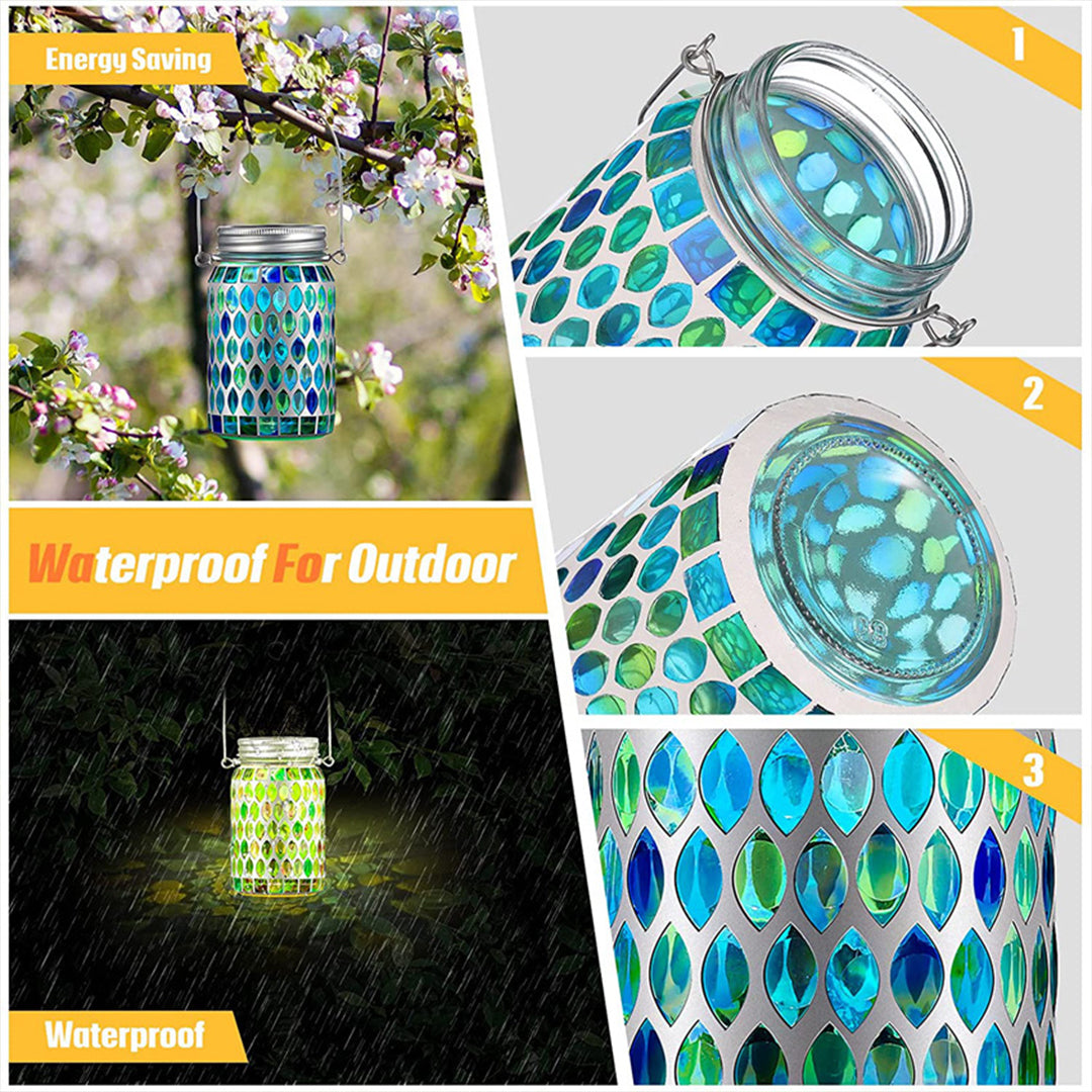 Two illuminated solar mosaic lights creating green and colorful light patterns on ground