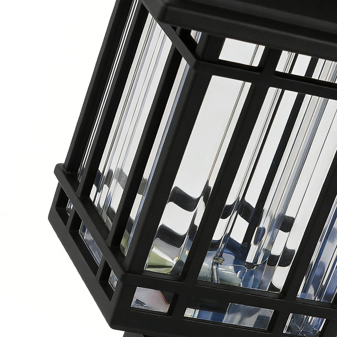 Solar outdoor lawn light with a detailed view of its glass panels and sturdy construction.