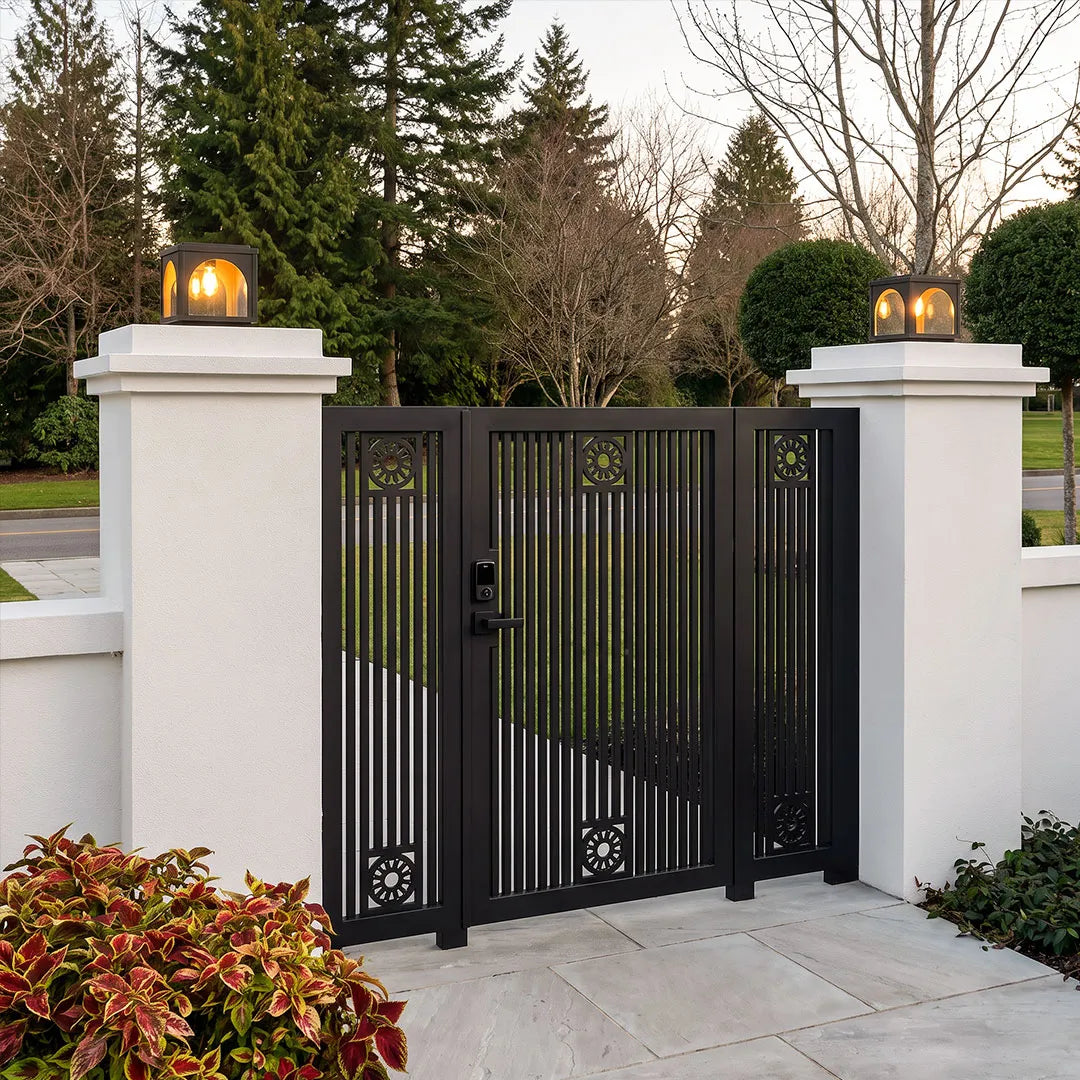 Solar outdoor pillar lights installed beside a driveway with elegant architectural lighting.