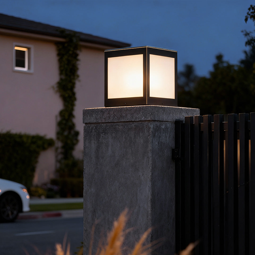 Solar outdoor pillar lights mounted on a stone pillar, providing eco-friendly lighting for pathways.