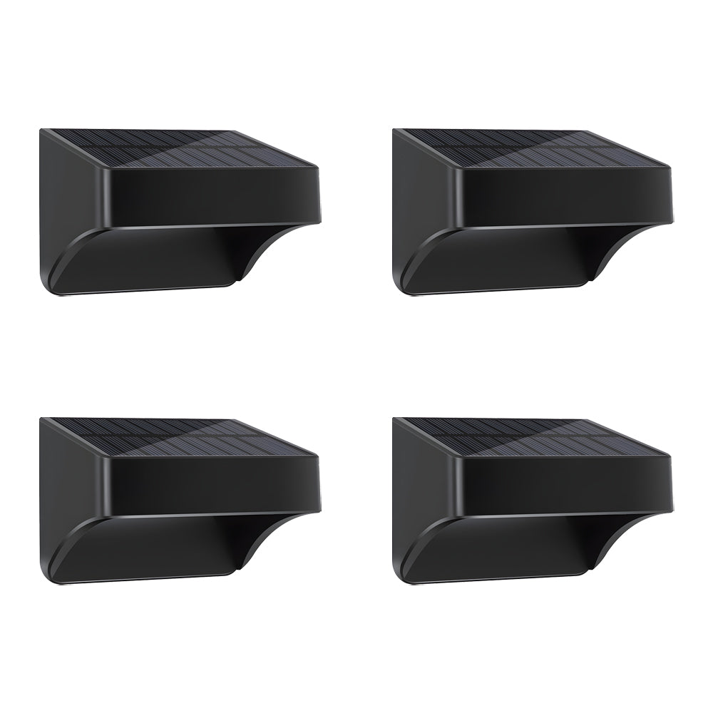 Solar outdoor wall light dusk to dawn illuminating a brick wall, highlighting texture and architectural details.