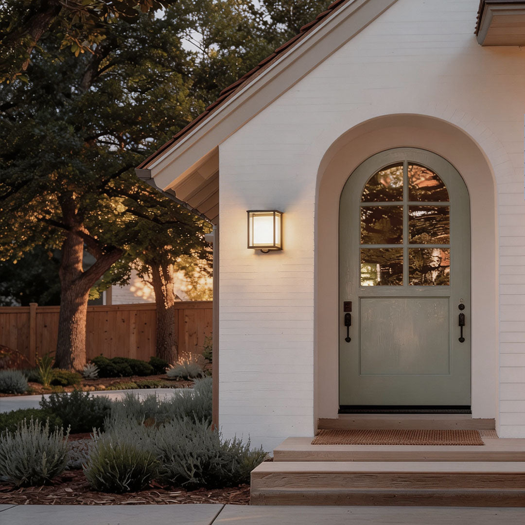Solar outdoor wall mounted lights with a sleek design, enhancing a white house facade.