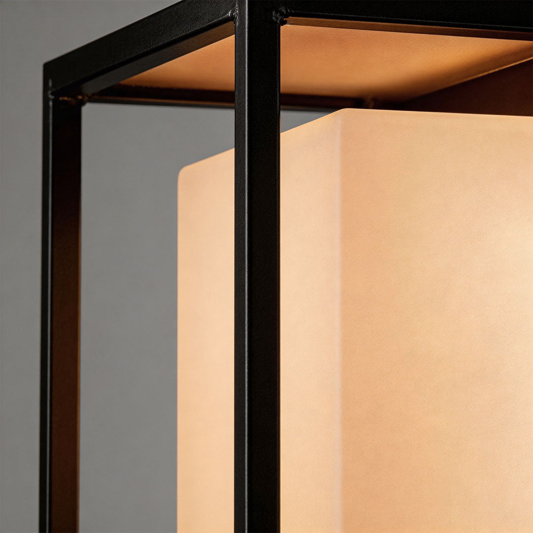 Solar outdoor wall mounted lights with a sleek design, mounted on a white wall.