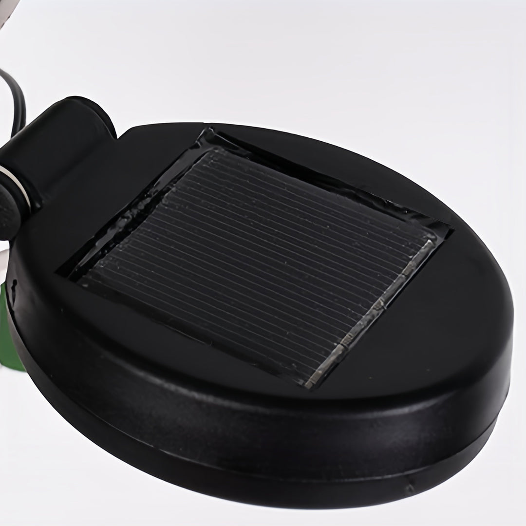 Solar panel base for powering ground stakes for Christmas lights, designed for outdoor use.