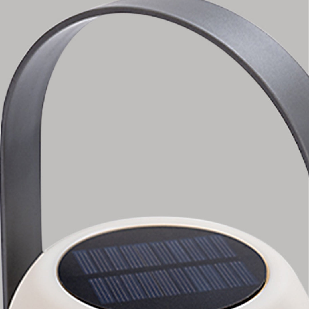 Close-up detail of solar panel integrated into top of portable lamp handle for eco-friendly charging
