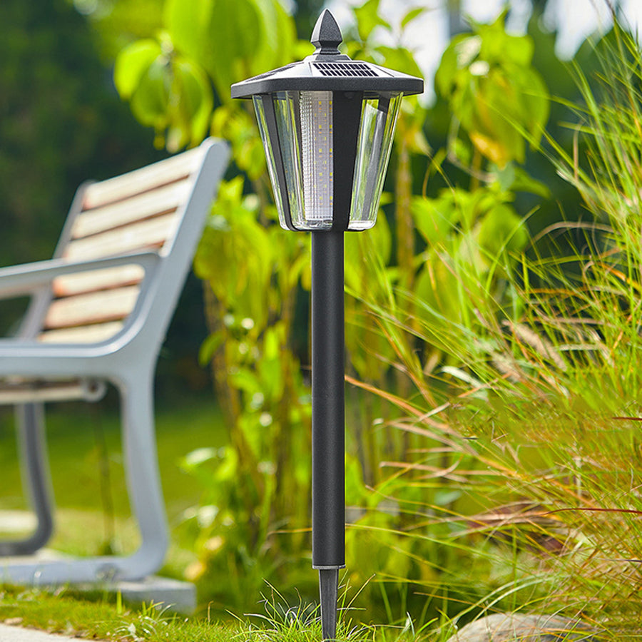 Modern solar garden light with decorative top and stake design for pathway illumination