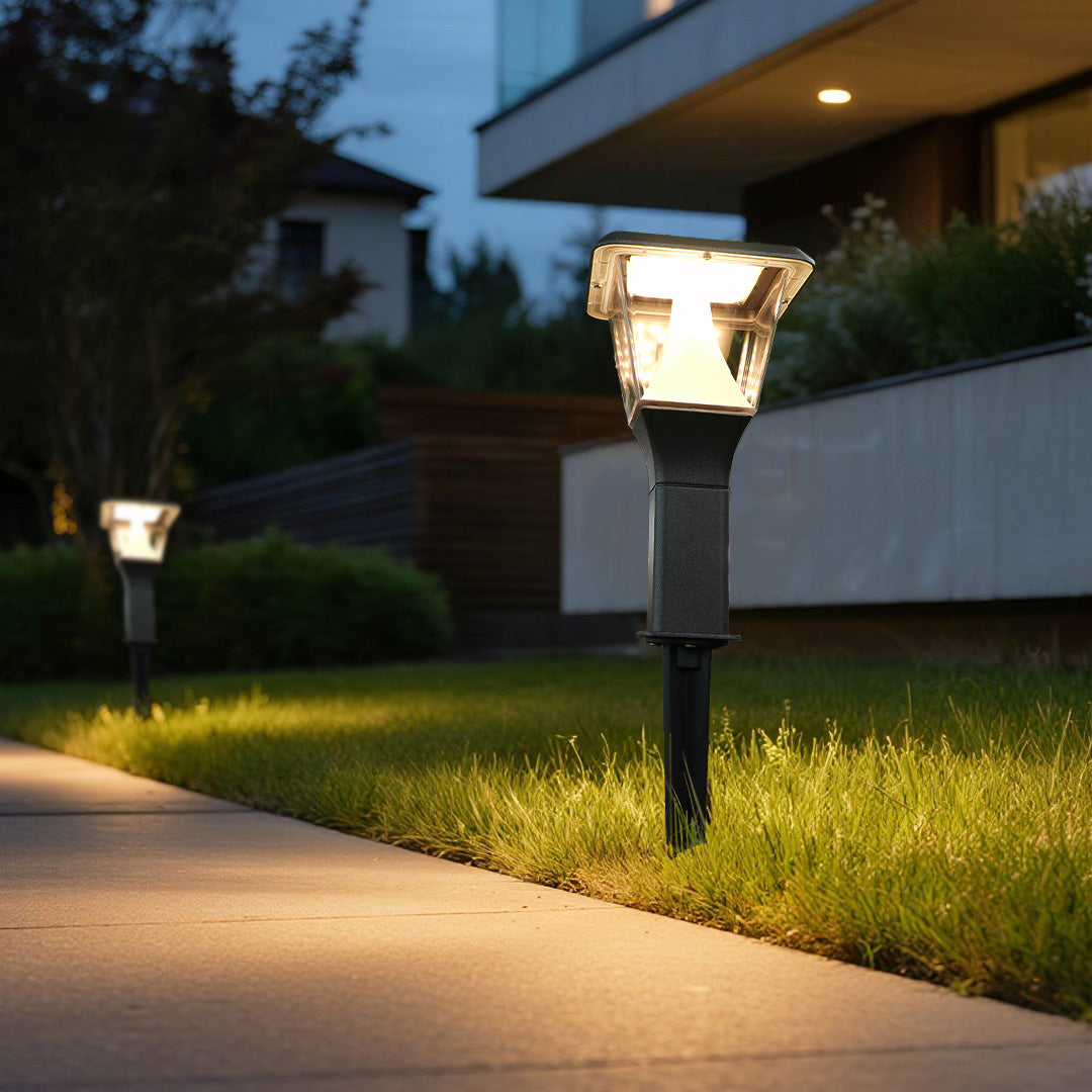 Solar pathway light illuminating garden walkway with soft ambient glow