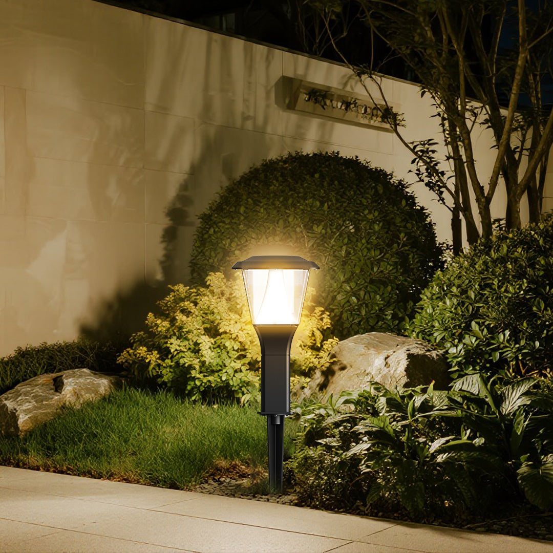 Solar pathway light illuminating garden walkway with soft ambient glow