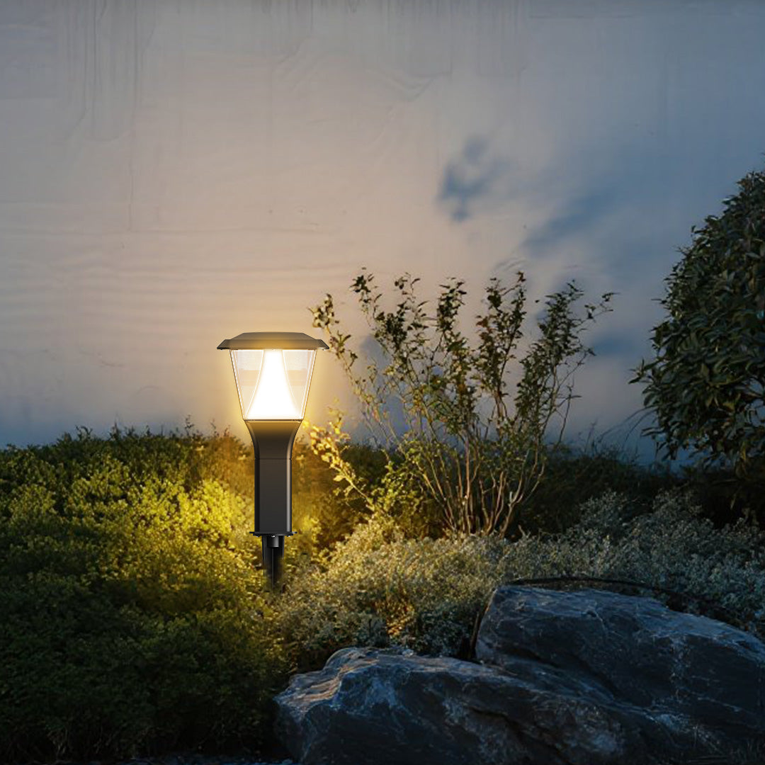 Solar pathway light illuminating garden walkway with soft ambient glow