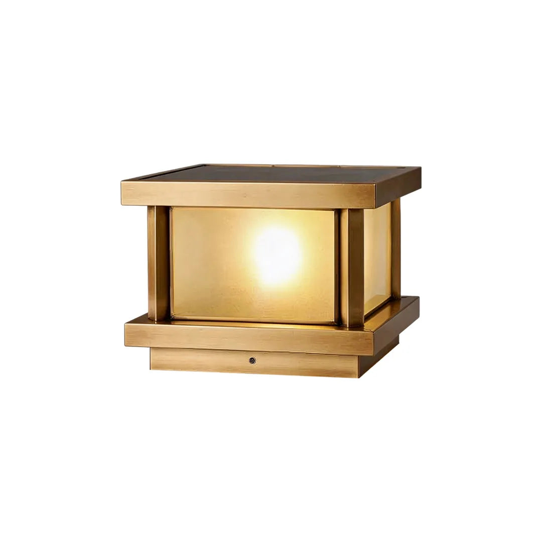 Solar pillar light with antique brass finish frosted glass and warm illumination