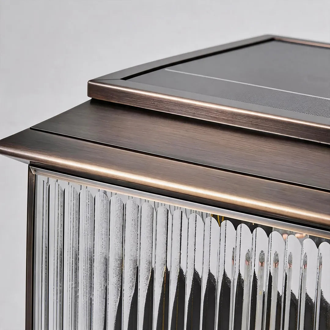 Solar pillar light with bronze metal frame ribbed glass and top solar panel
