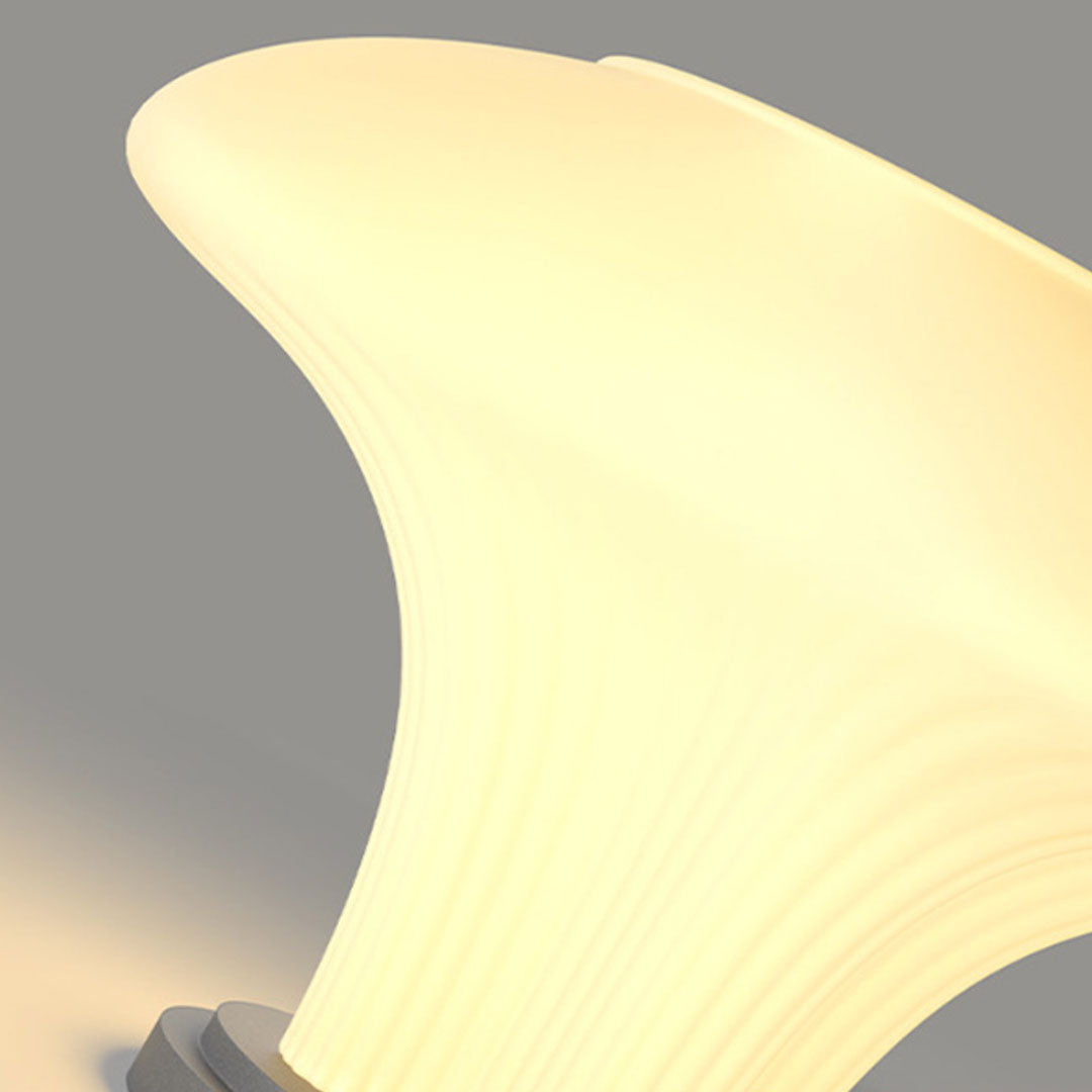 Solar pillar light close-up featuring curved illuminated shade with soft warm lighting effect.