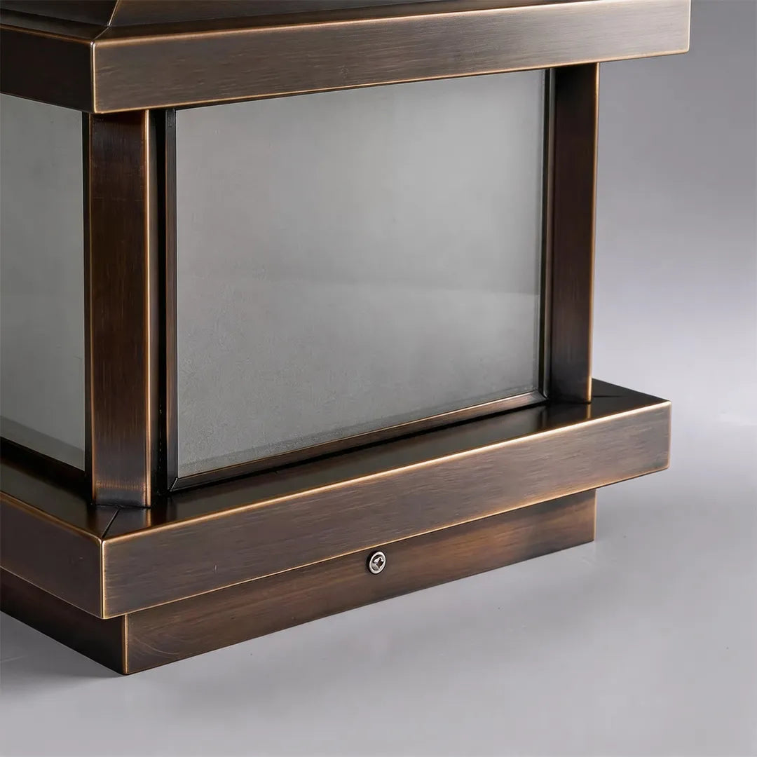 Solar pillar light with bronze metal frame and glass panel detail